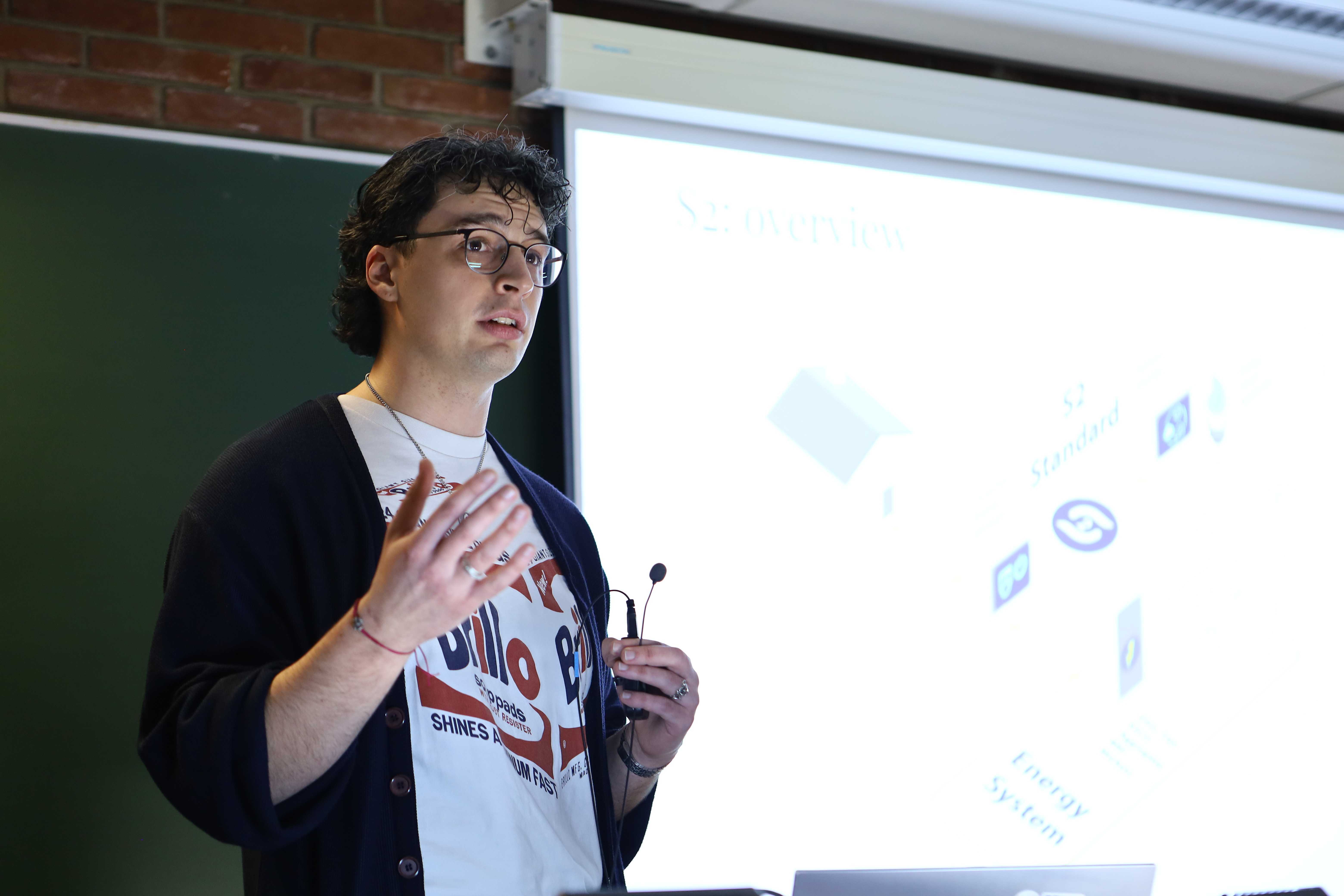 Vlad presenting at FOSDEM 2025